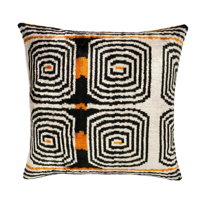 Silk velvet pillow cover with cream, black, and orange labyrinth ikat geometric pattern