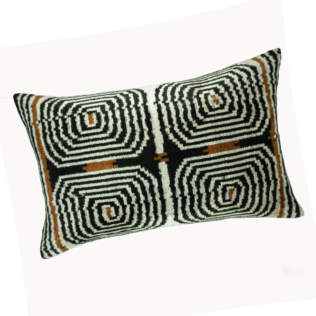 Ikat throw pillow cover, black/white labyrinth swirl pattern with brown accent squares
