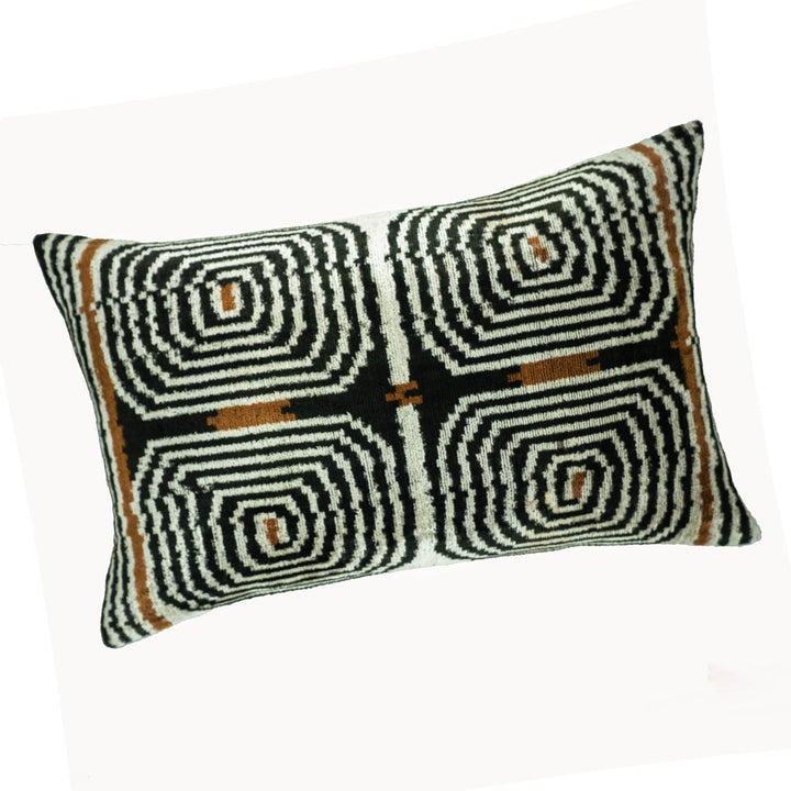 Ikat throw pillow cover, black/white labyrinth swirl pattern with brown accent squares