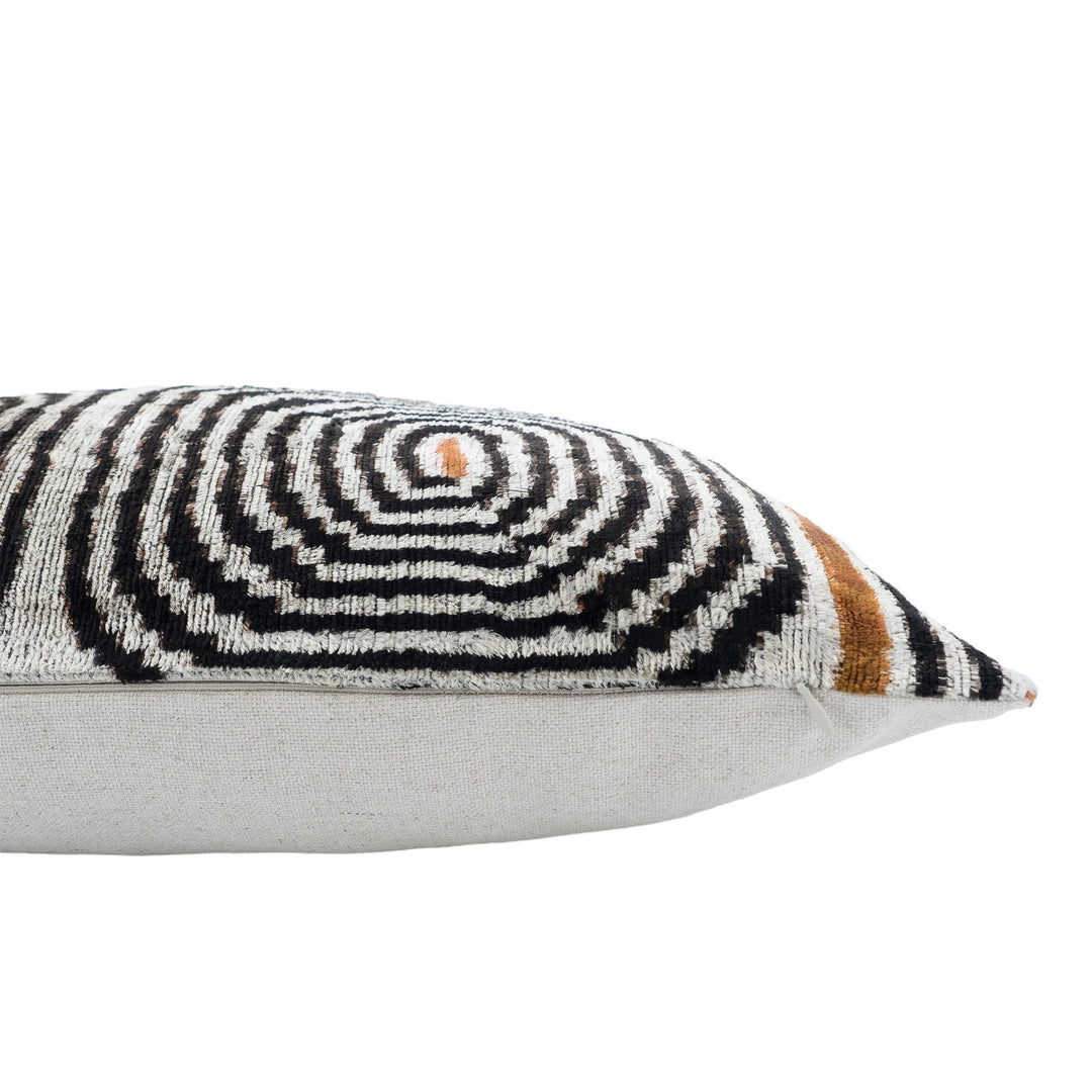 Ikat throw pillow cover side view, black/white swirl pattern with brown trim