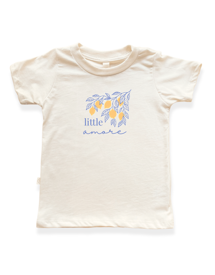 Kids organic cotton T-shirt, cream with blue leaf “little amore” graphic on front.