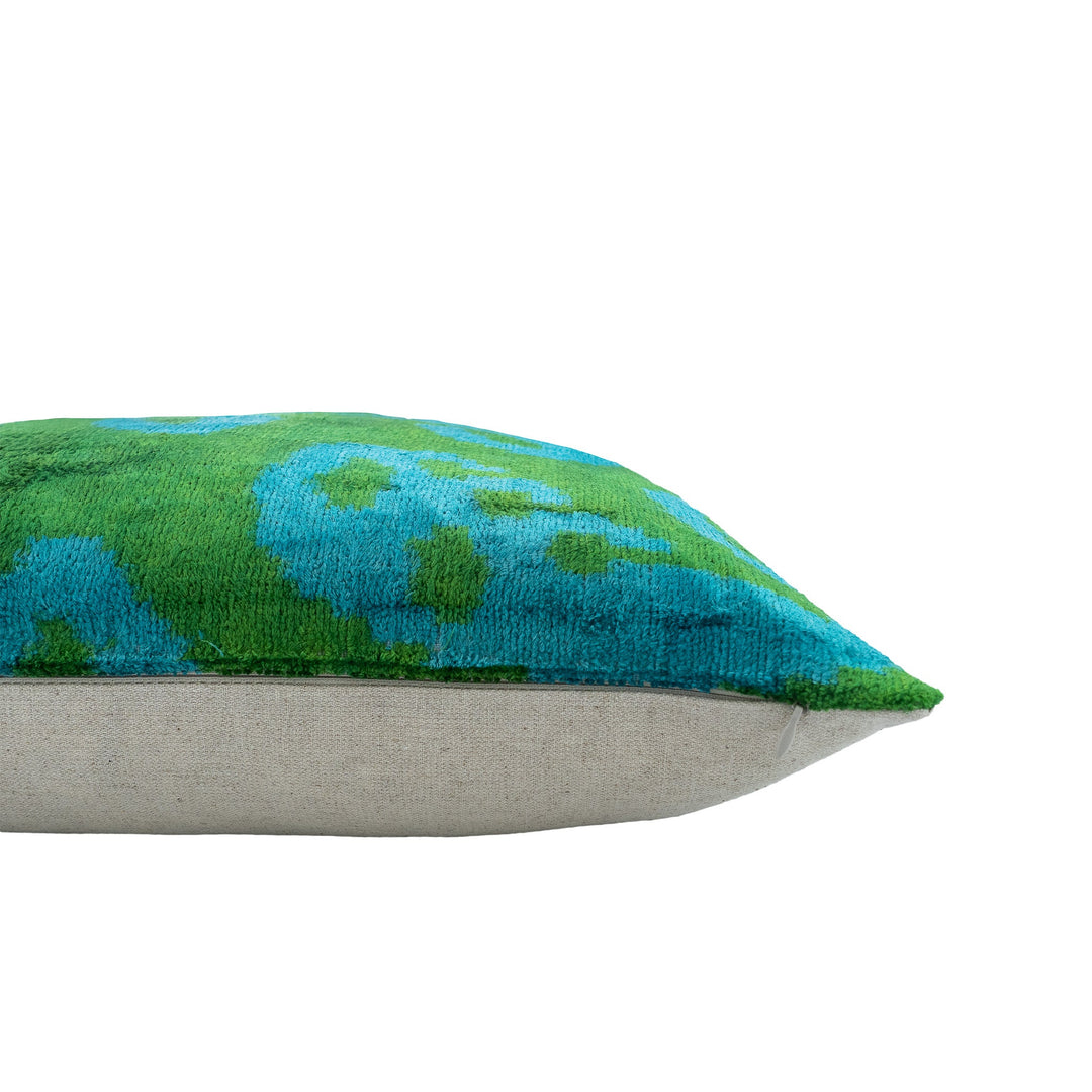 20 x 20-inch ikat velvet pillow, blue-green patterned front and beige back, side view