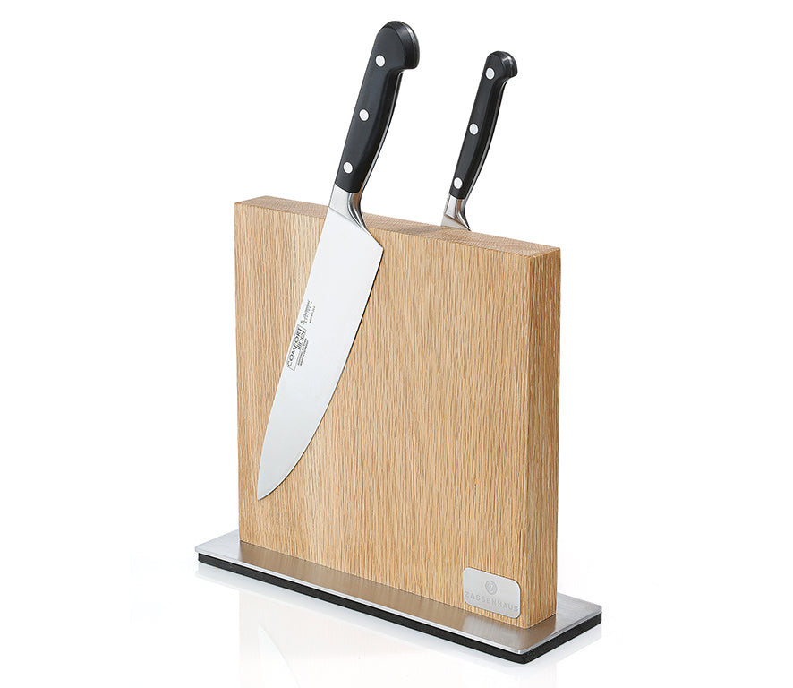 Light wood magnetic knife block with two knives upright in the wooden slots