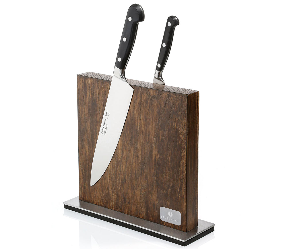 Dark wood magnetic knife block with two knives in vertical slots on a black base
