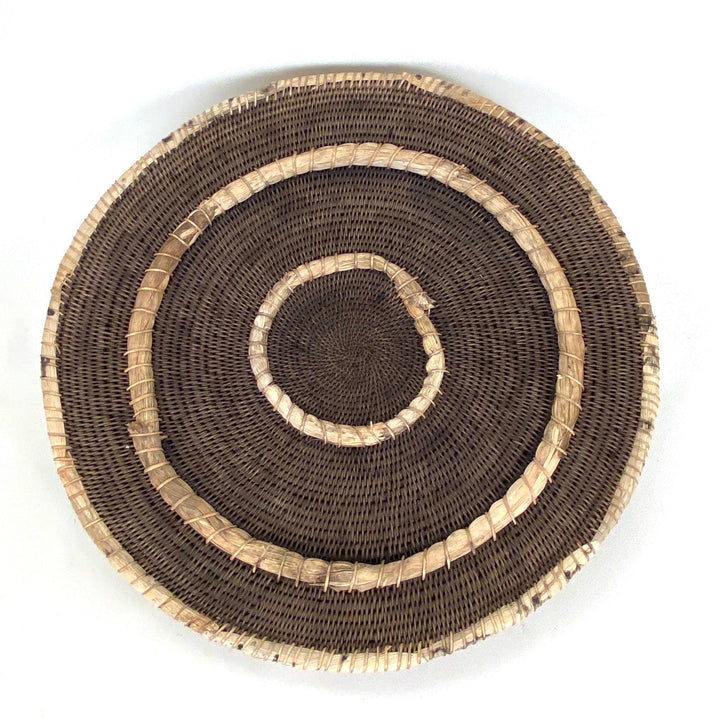 Small woven basket with dark brown weave and tan stitched circular band detail