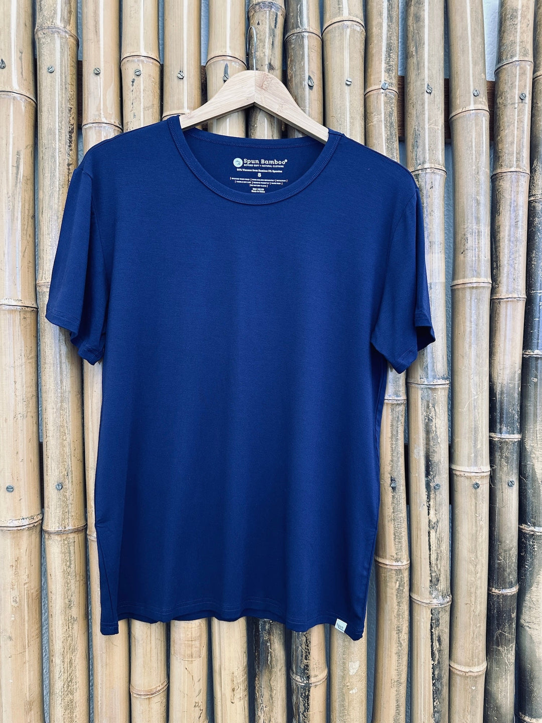 Navy short-sleeve crew-neck lounge T-shirt displayed on wooden hanger