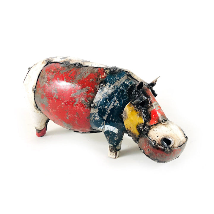 Recycled metal pig figurine with red belly and blue-black patches, front side