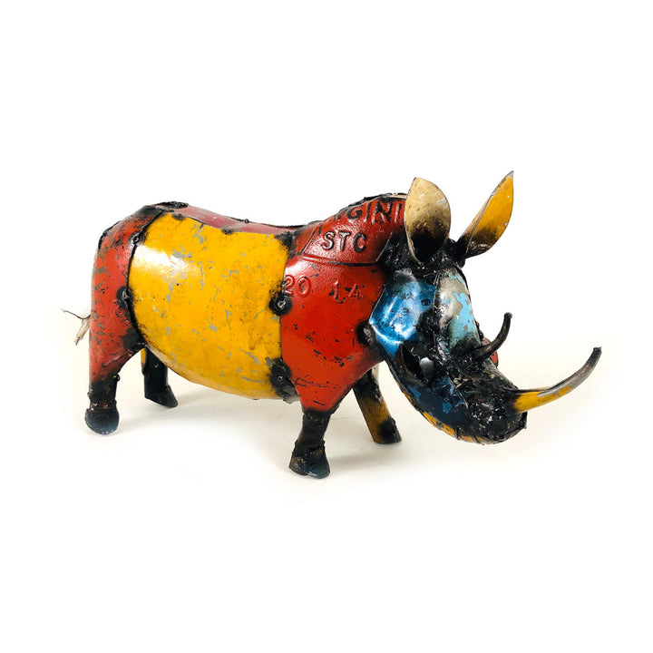 Recycled metal rhino sculpture, front side view, yellow and red body with blue accents