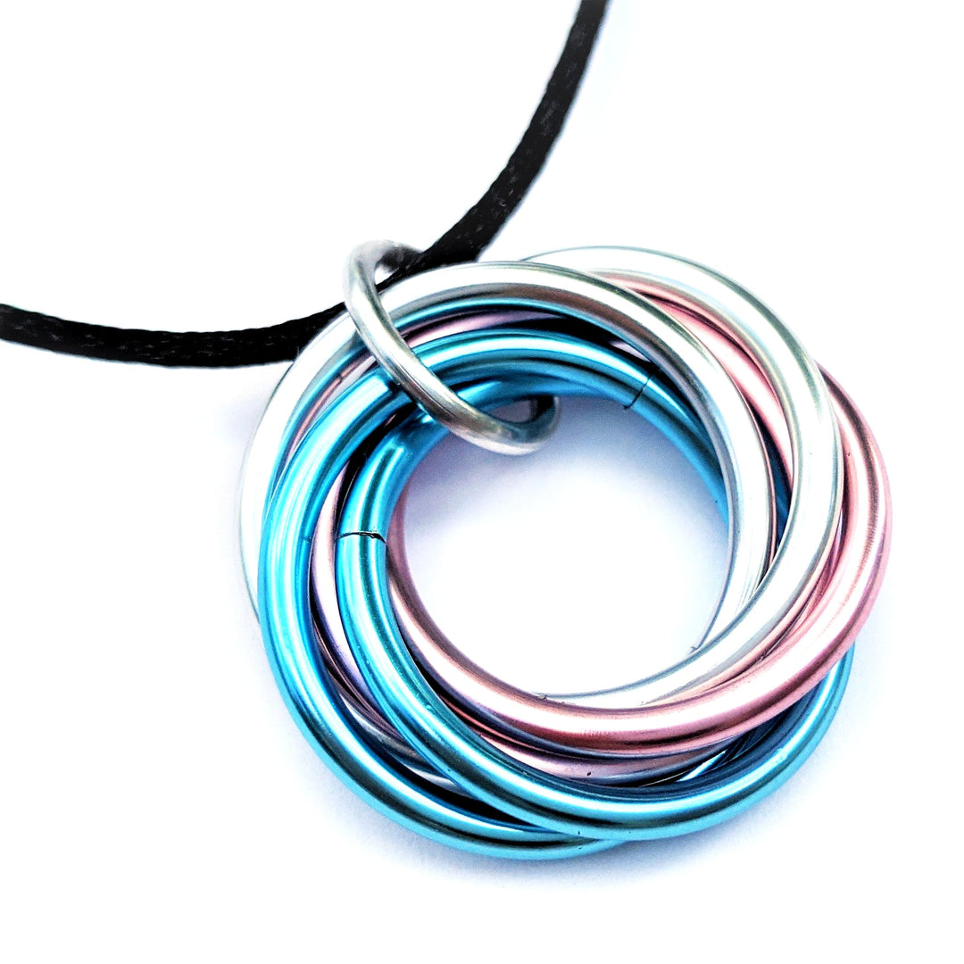 Multiring fidget necklace with black cord and blue-pink iridescent hoop pendant