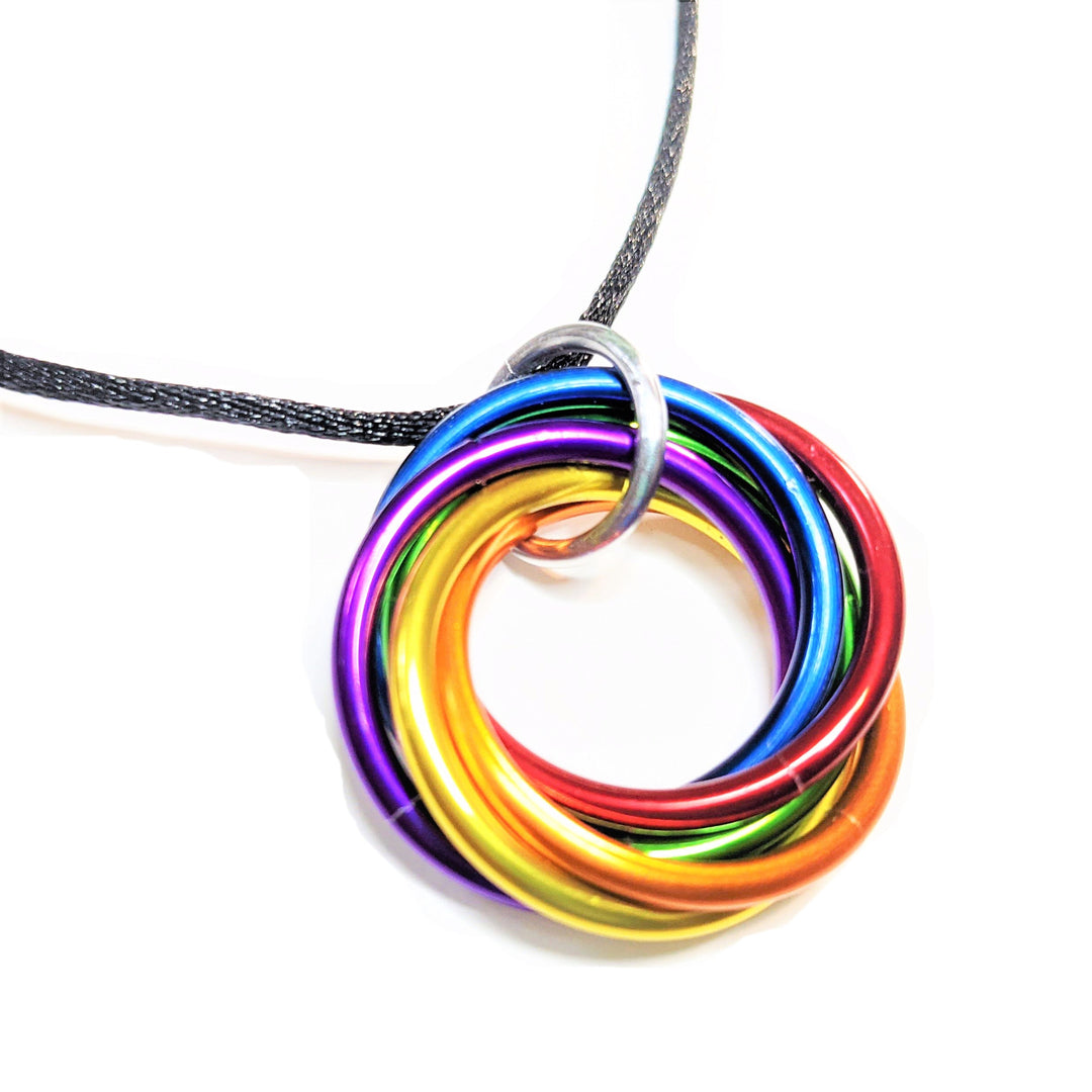 Multiring fidget necklace with black cord and rainbow iridescent hoop pendant