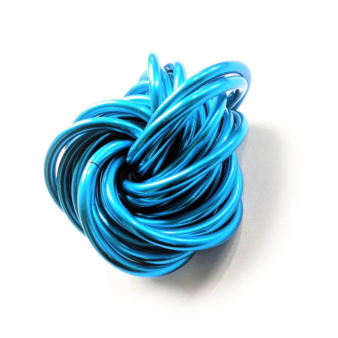 Aqua blue metallic twist fidget stress ball, knotted loop desk toy.