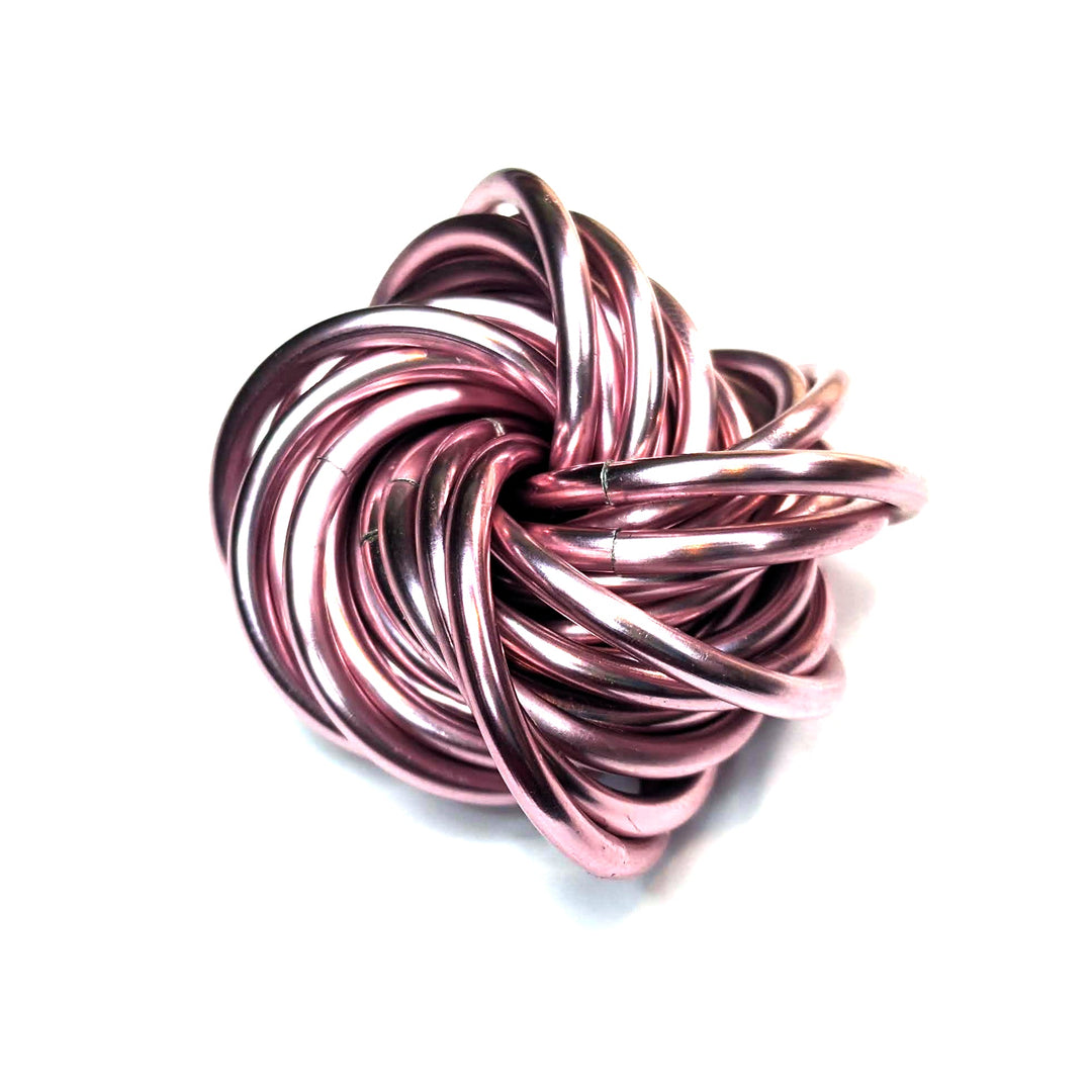 Rose metallic stress ball fidget toy, twisted looped cords in a compact ball.