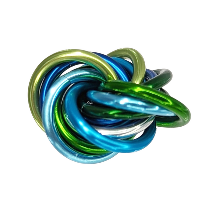 Shiny multicolor fidget stress ball with glossy blue, green, and yellow interlocking rings.