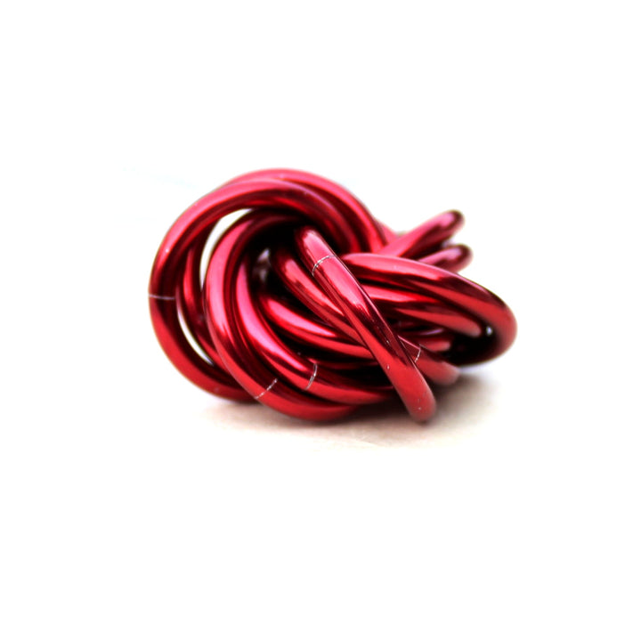 Metallic red twisted stress ball fidget toy, coiled rings shape