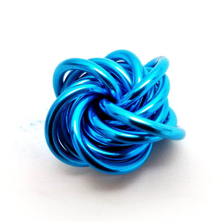 Bright blue stress fidget ball with interwoven twisted loops knot.