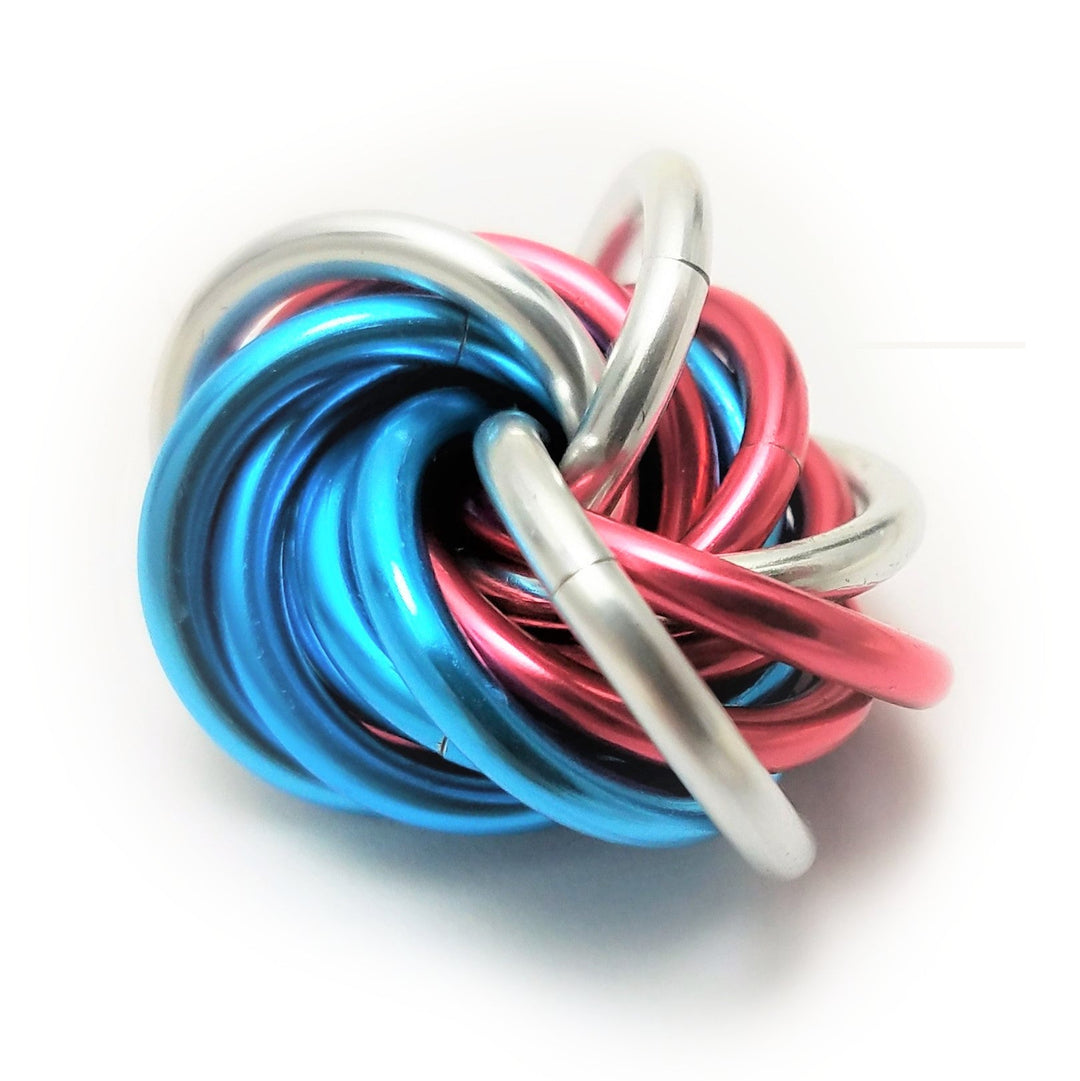Multicolor metal fidget ball toy with blue and red coils and silver connector prongs