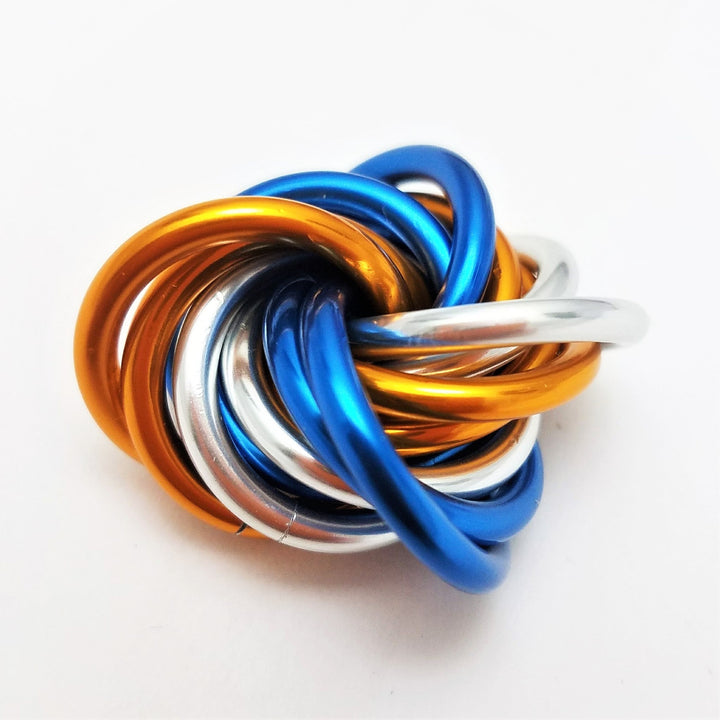 Multicolor metal fidget ball with braided loops, blue orange gold and silver
