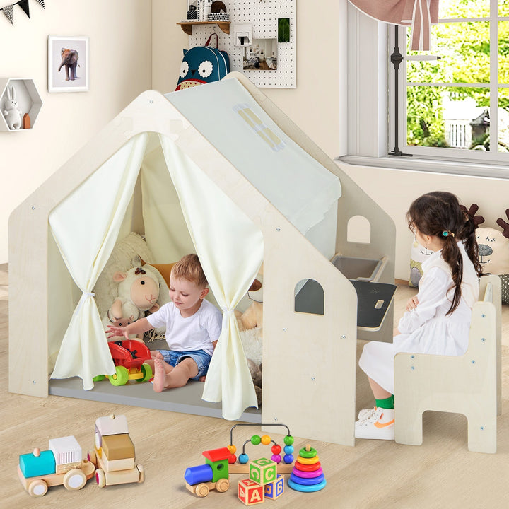 Beige Montessori playhouse with white curtains and play panels, includes storage bin and mat