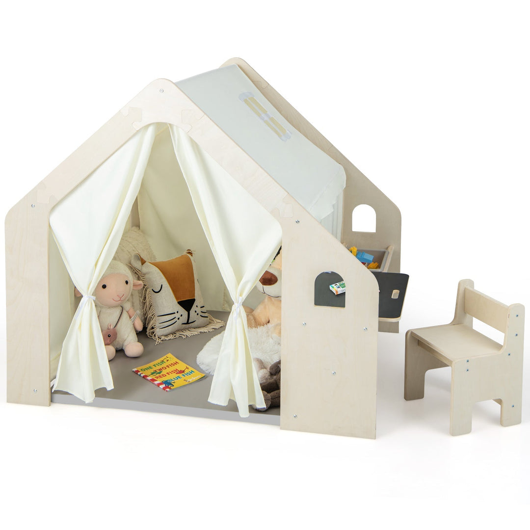 Beige wooden playhouse with white curtains, chalkboard side panel, and small chair