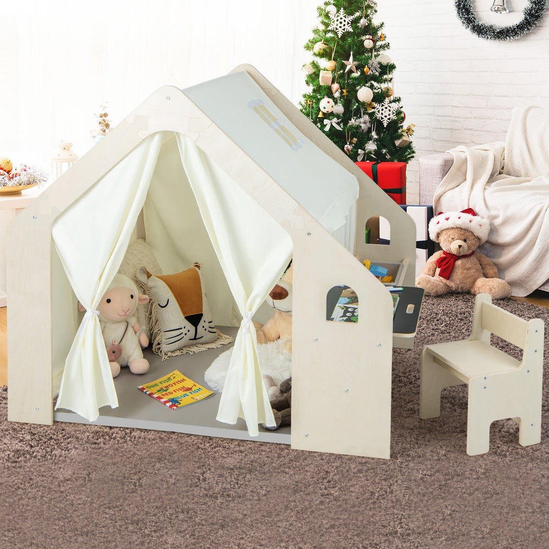Beige Montessori playhouse with white curtains and open storage bin for toddlers