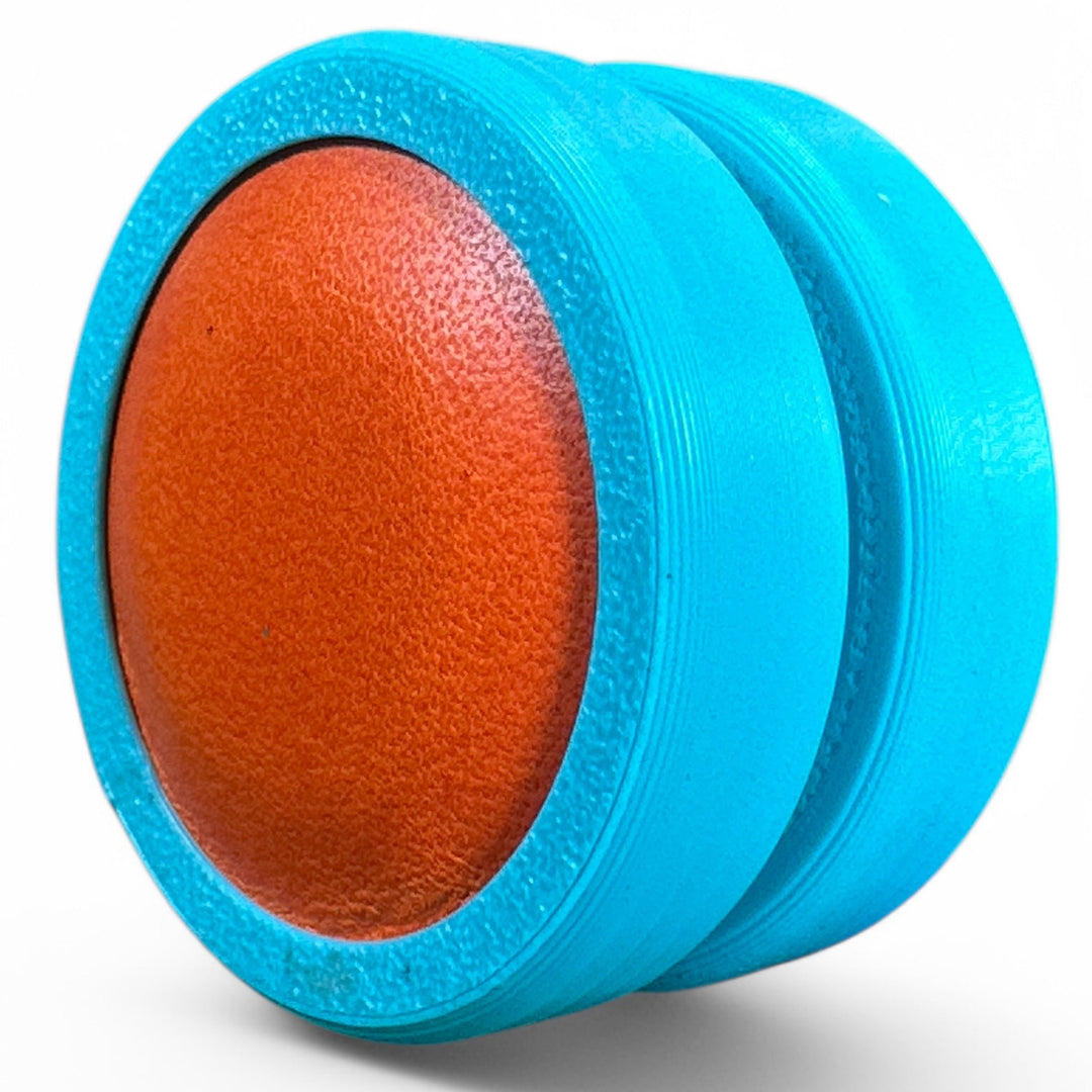 Blue fidget moon toy with orange oval center, two stacked rings
