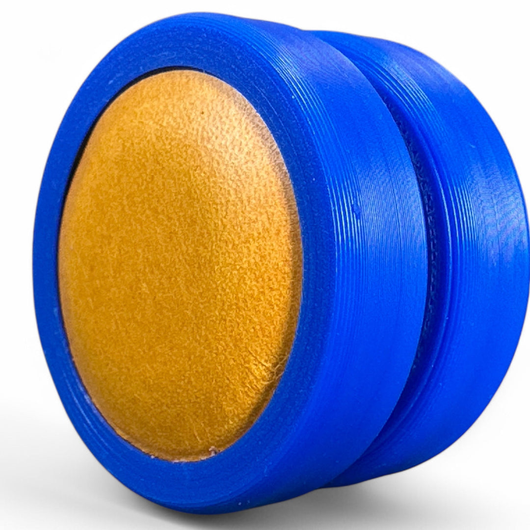 Blue fidget moon toy with gold oval center, two stacked rings