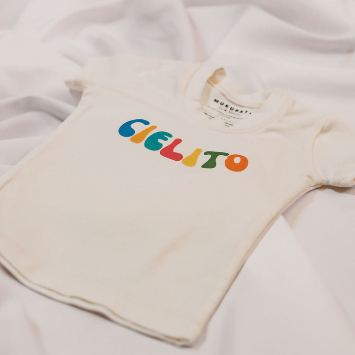 White organic cotton baby T-shirt close-up: &