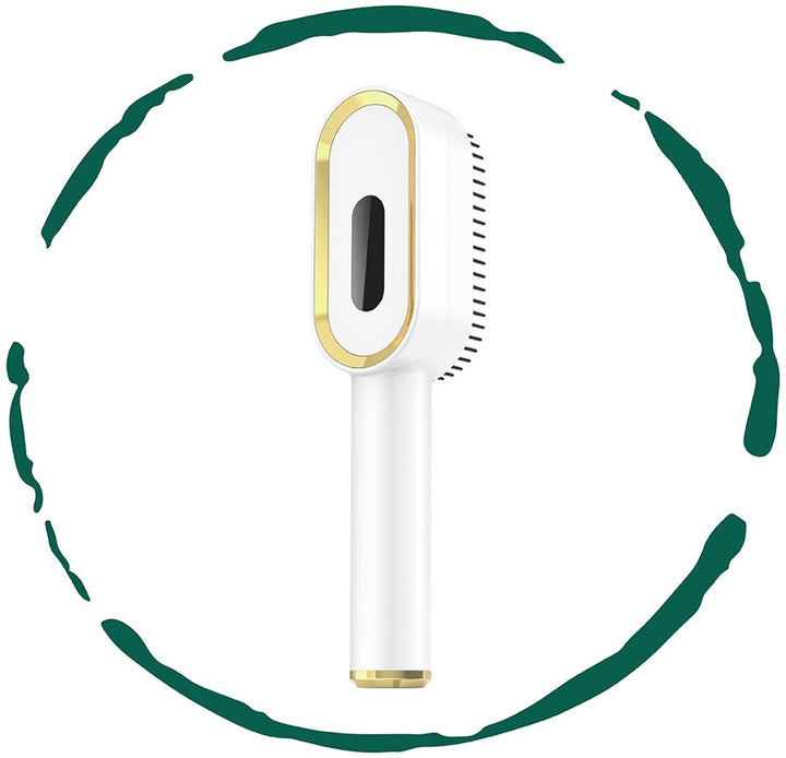 3-in-1 scalp massager and oil applicator brush with black bristle head and gold trim