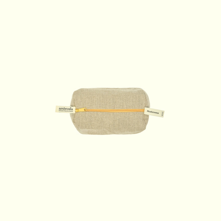 Beige linen storage bag with tan strap and gold zipper seam for mushroom contents