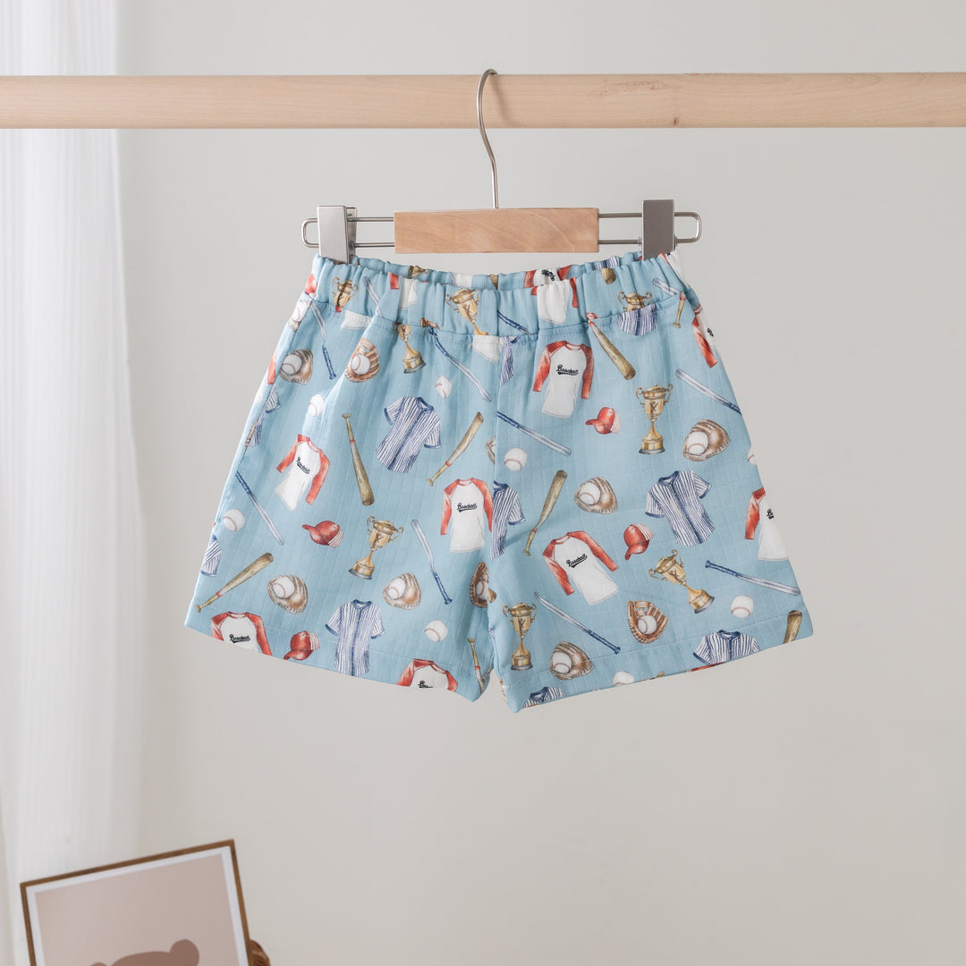 Light blue organic muslin shorts with baseball-themed print and elastic waistband