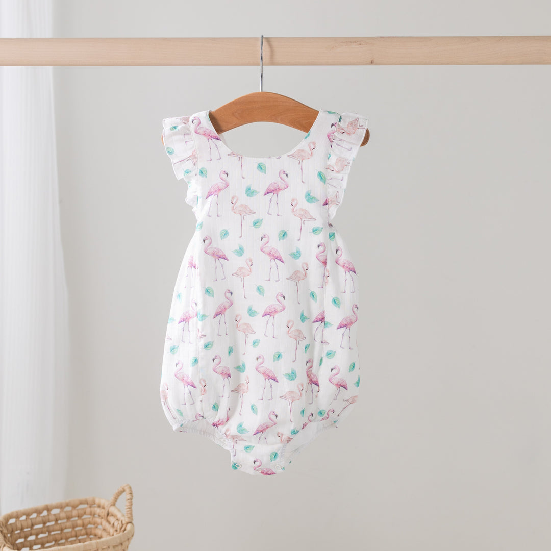 Light pink muslin bubble romper with flamingo print and ruffled cap sleeves