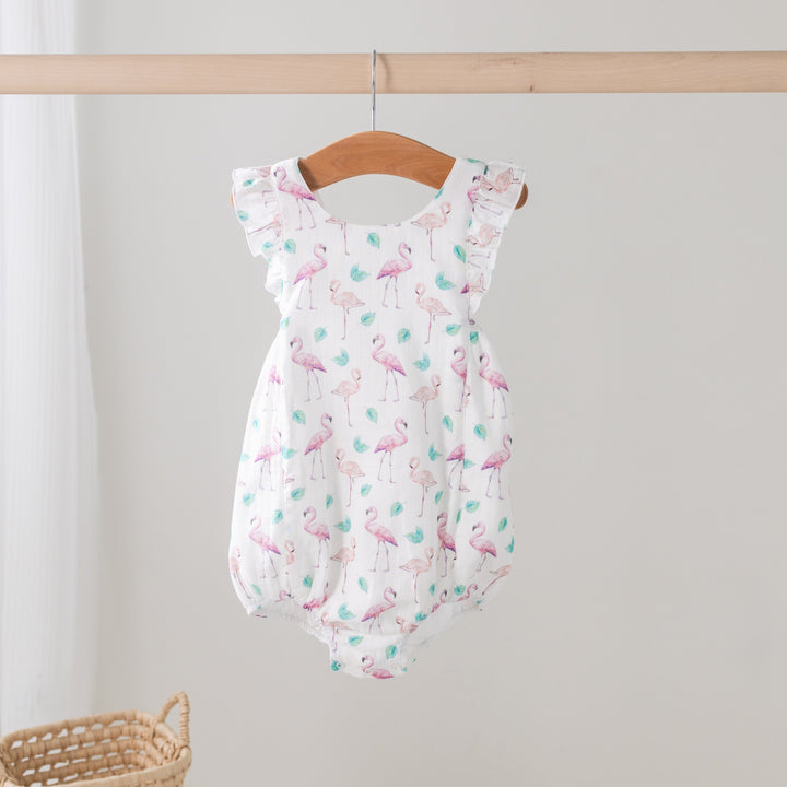 Light pink muslin bubble romper with flamingo print and ruffled cap sleeves
