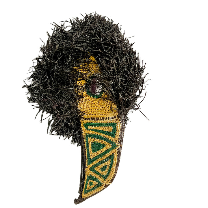 Toucan mask head-on view with black shag fur and yellow-and-green embroidered beak area