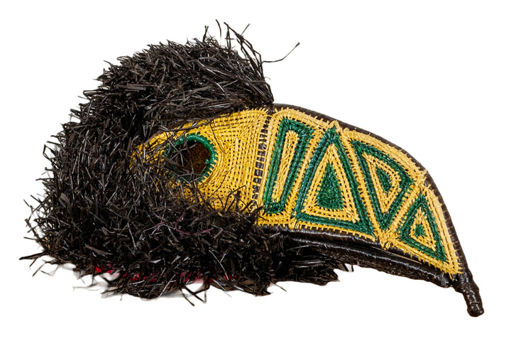 Channel-billed toucan mask with black shag, yellow beak, and green geometric embroidery
