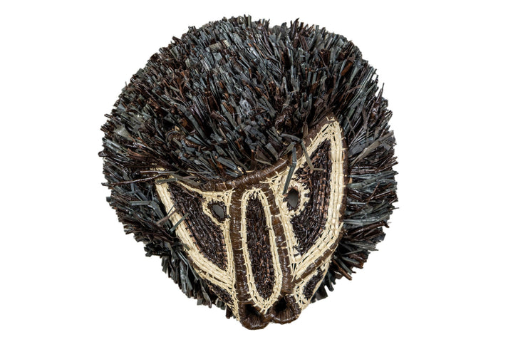 Black and white colobus monkey mask with dark shag fringe and cream face embroidery