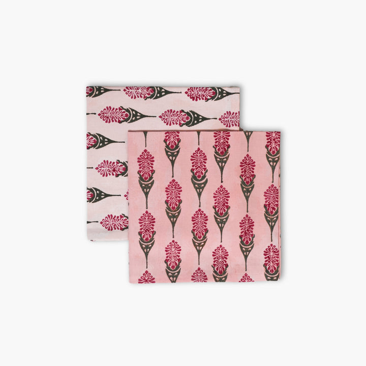 Pink table napkins set of 2 with black and red floral motifs, folded