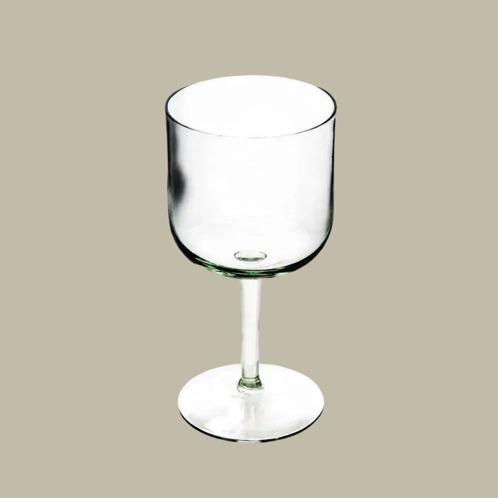 Stemmed wine glass with clear glass bowl and short foot