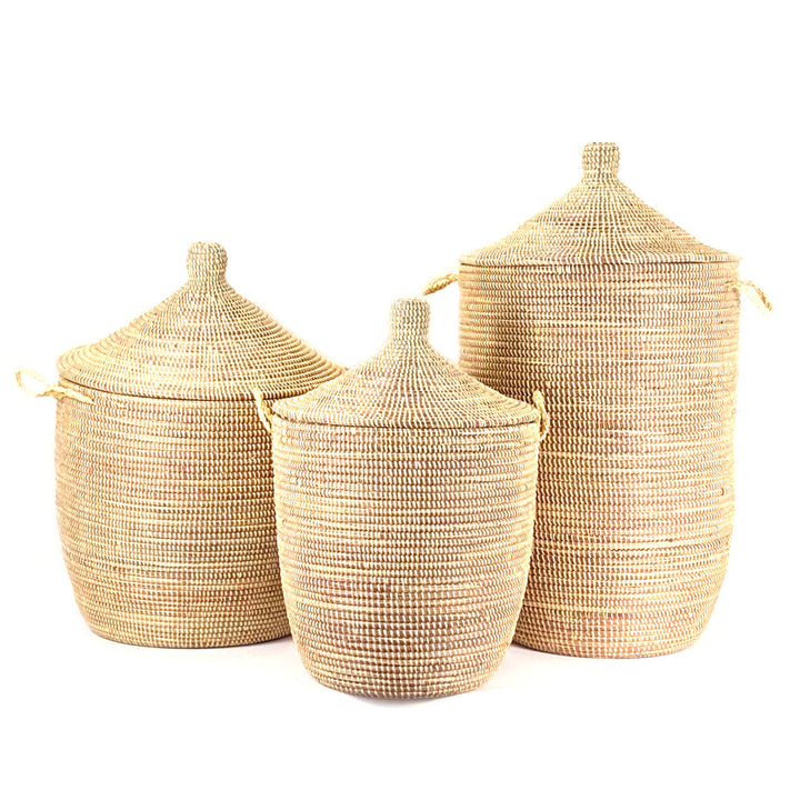 Set of three natural woven floor baskets with lids and knobs, nesting design