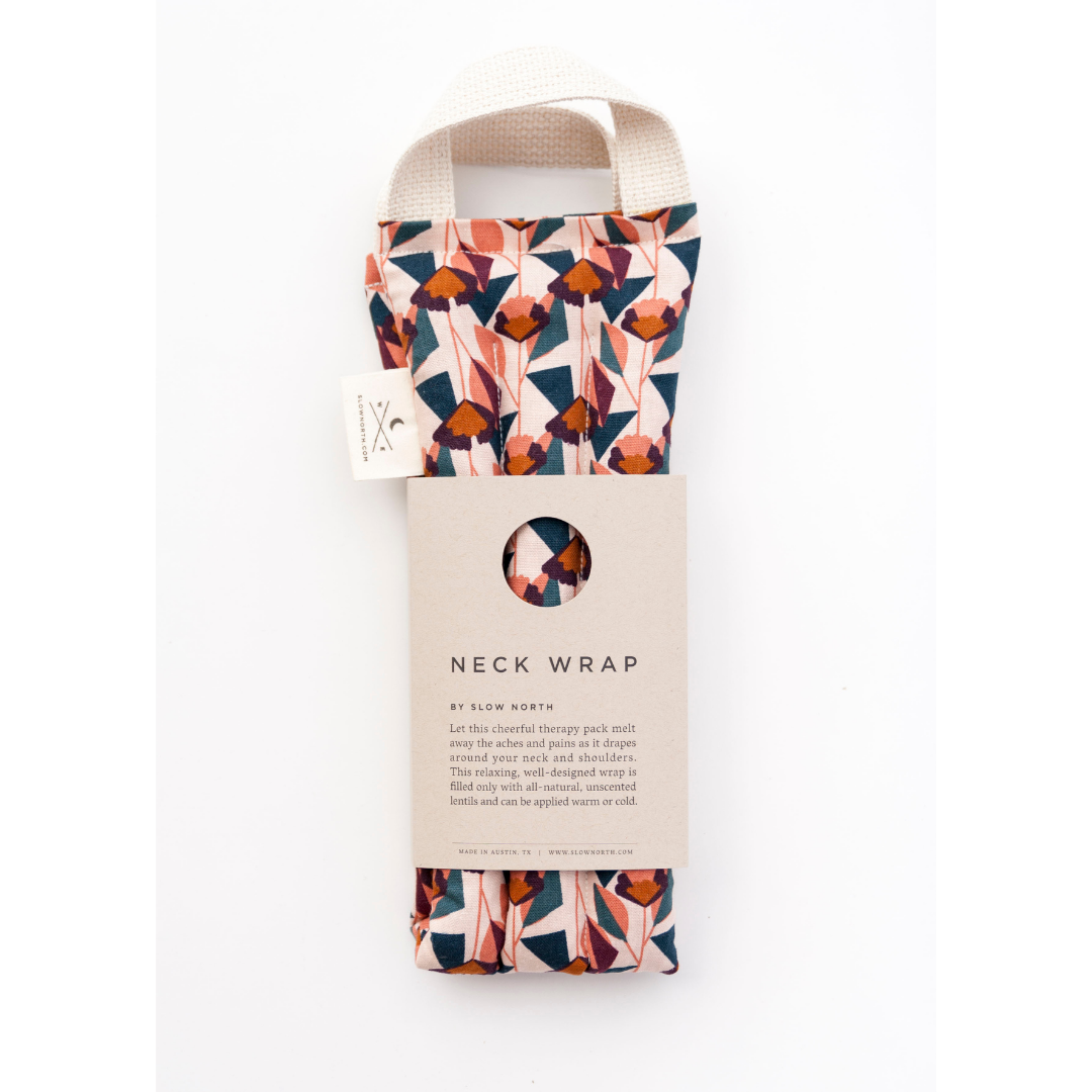 Blush floral neck wrap with hanging product card and tag, folded fabric pouch