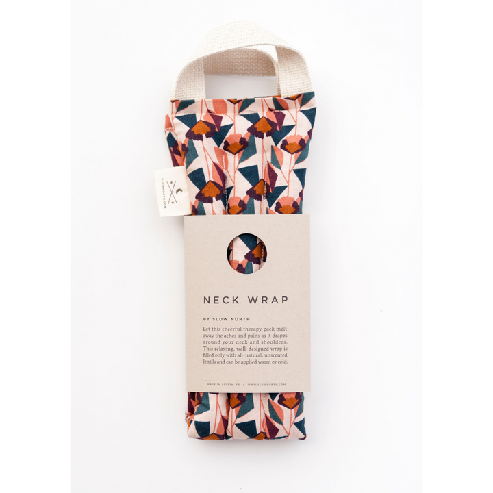 Blush floral neck wrap with hanging product card and tag, folded fabric pouch