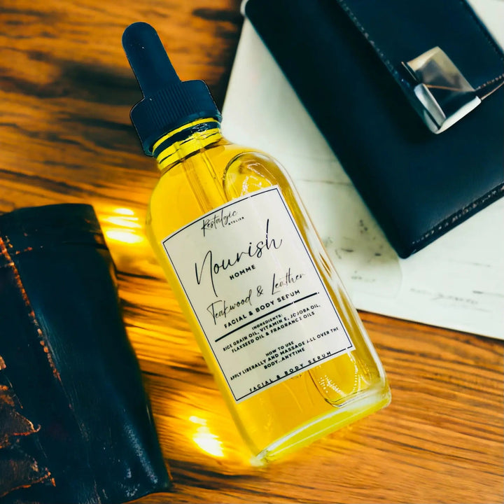 Amber Nourish facial and body serum bottle with black dropper, close view