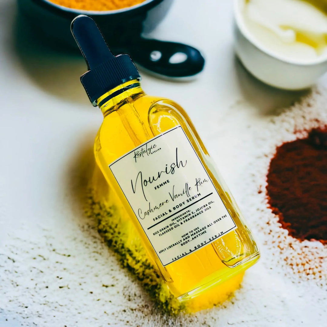 Amber Nourish facial and body serum bottle with black dropper and white label