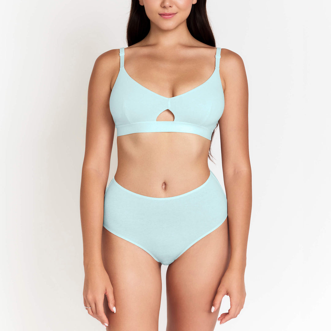 High-rise brief in light blue with high waist band and smooth fabric, front view.