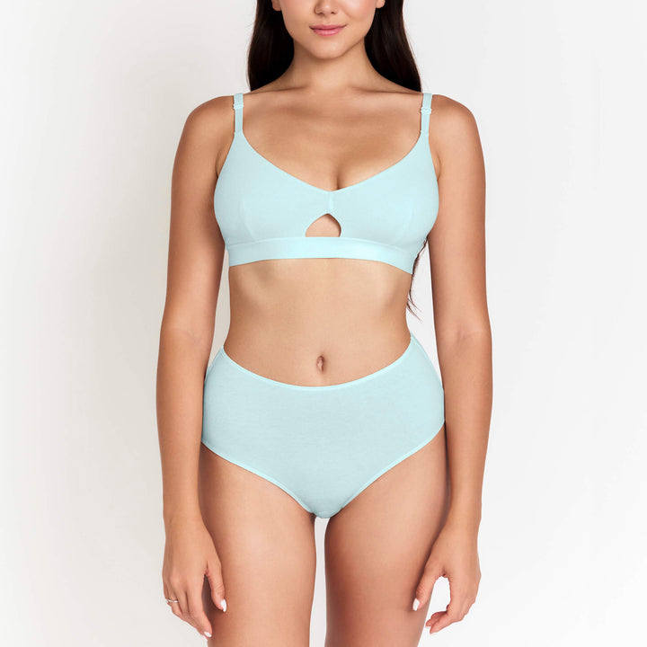High-rise brief in light blue with high waist band and smooth fabric, front view.