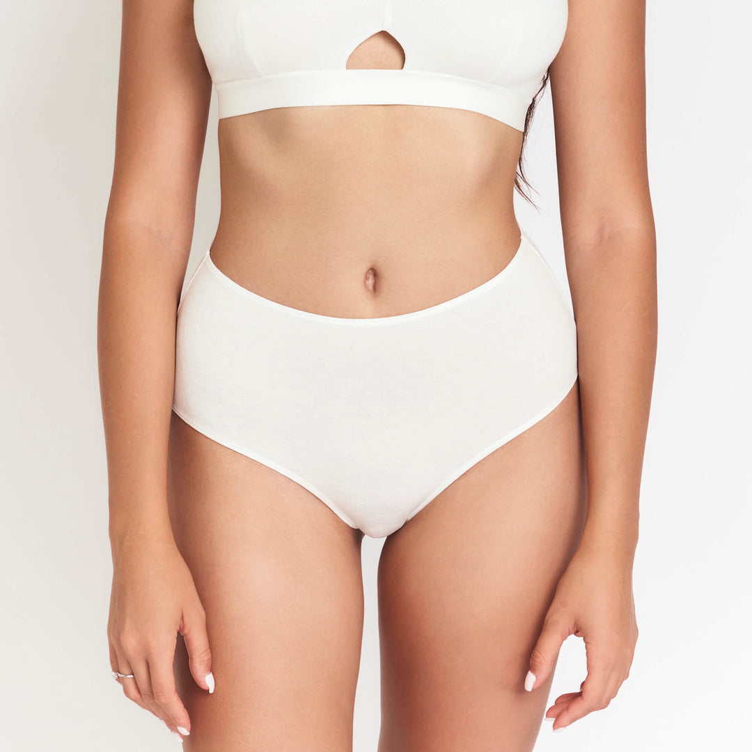 High-rise brief underwear in white with full coverage waist and hip-hugging fit.
