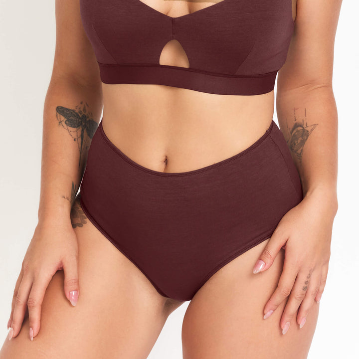 High-rise briefs in dark maroon, scoop front with small keyhole cutout.