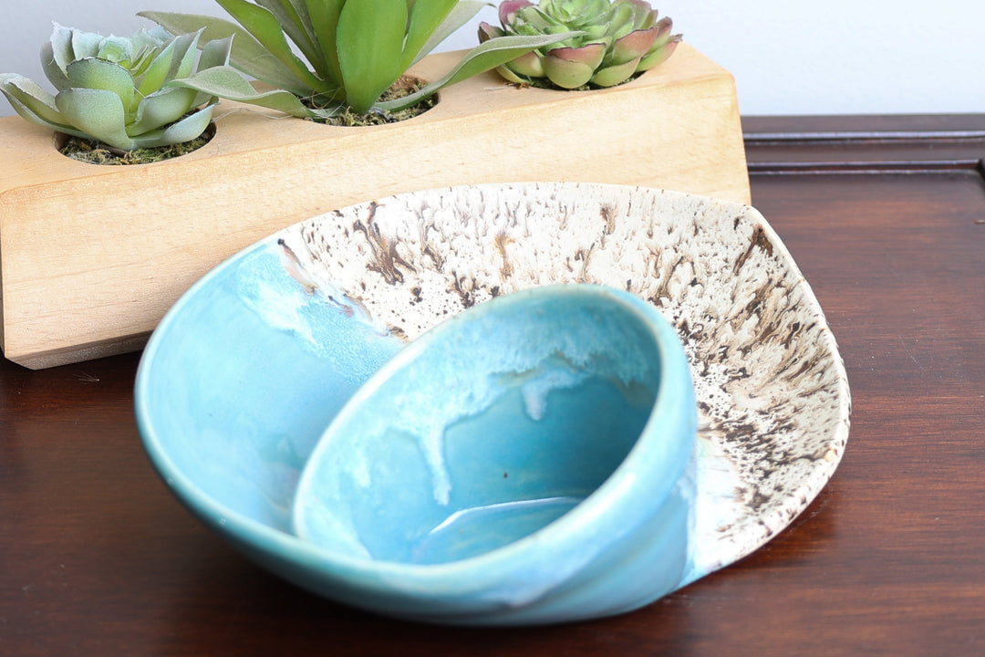 Coastal ceramic bowl set with blue inner dish and beige speckled swirl exterior