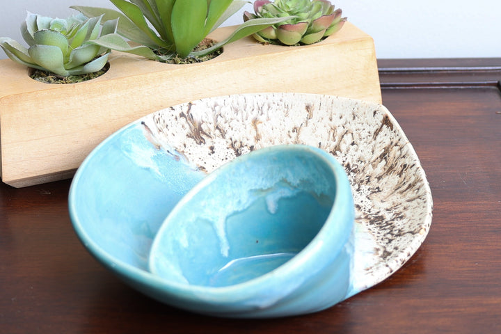 Coastal ceramic bowl set with blue inner dish and beige speckled swirl exterior