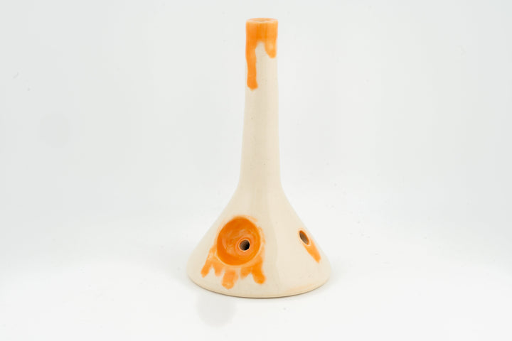 Ceramic beaker pipe with orange drips over cream body and side holes