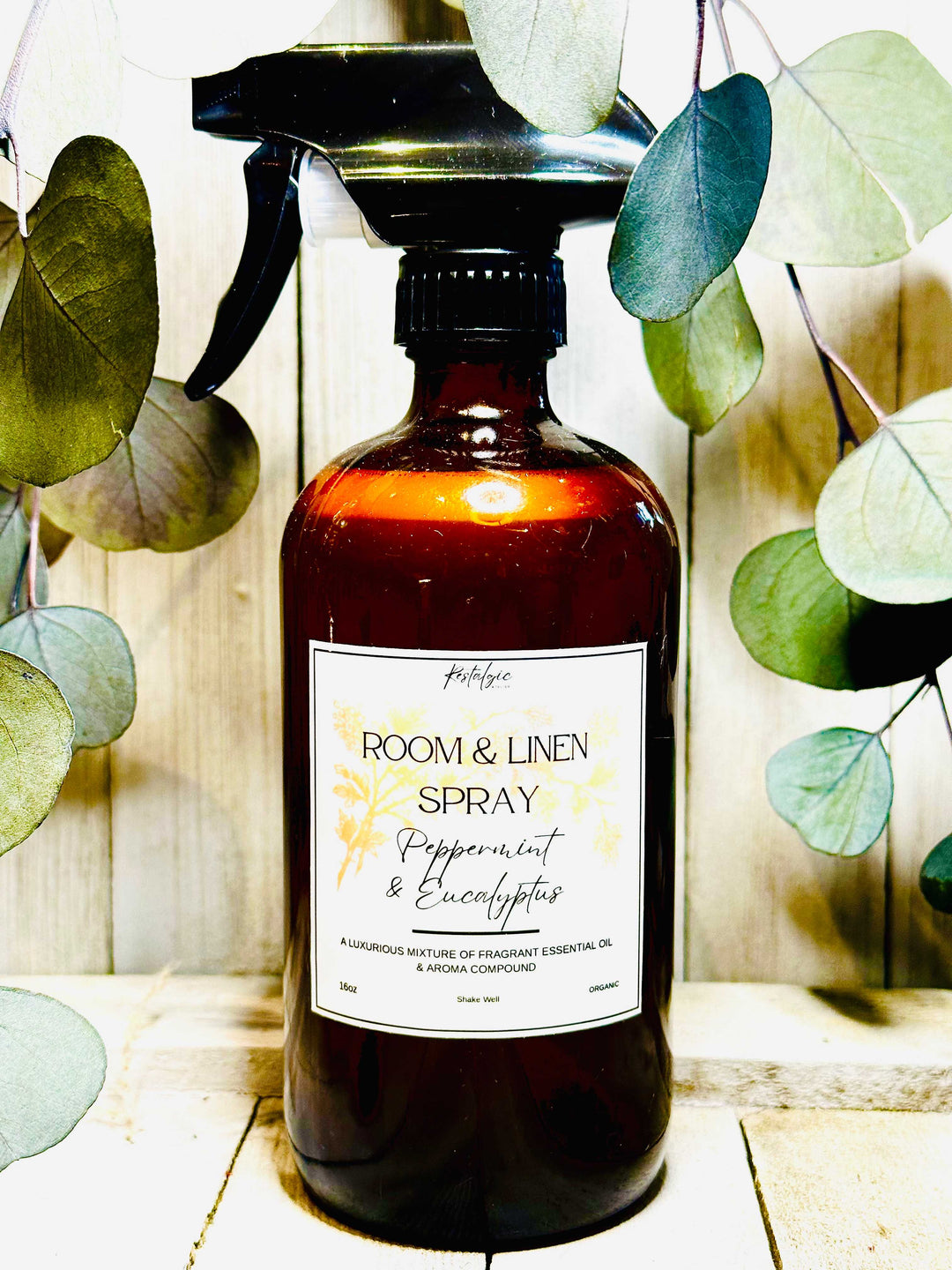 Amber glass room &amp; linen spray bottle with black trigger sprayer and Peppermint &amp; Eucalyptus label